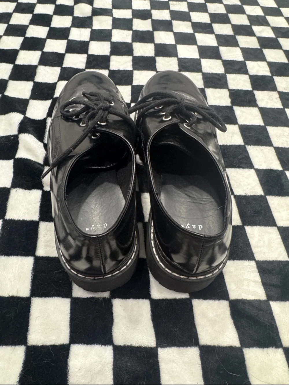a new day glossy black